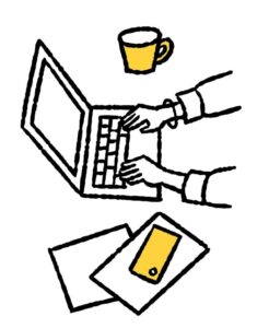 パソコンを使って調べものをする人の手元