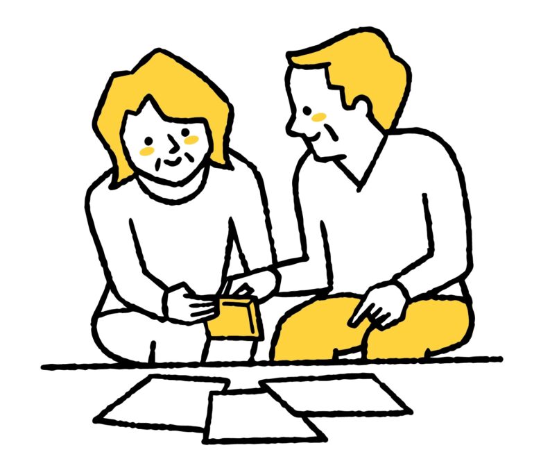 書類を集めて計算する夫婦