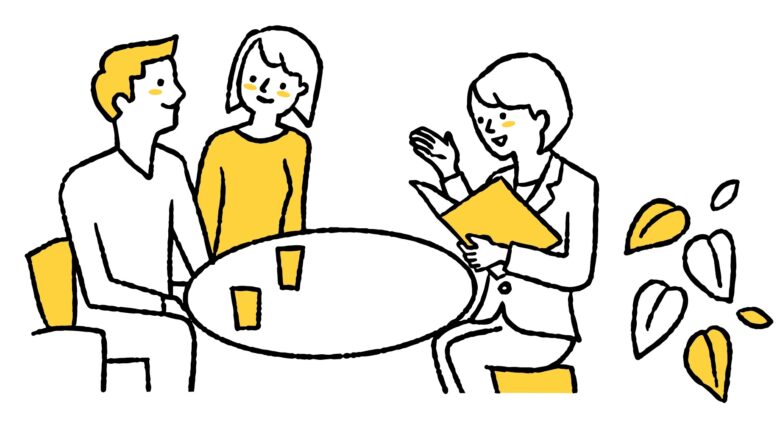 担当者の説明を聞く夫婦